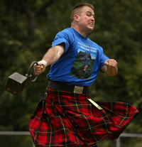 A man competes in a hammer toss during the Texas Scottish Festival and Highland Games in Arlington.